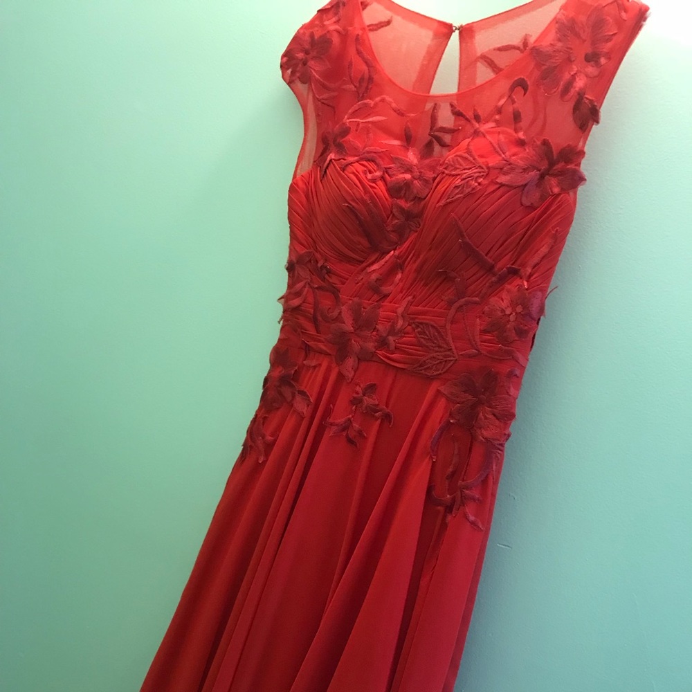 Red floor length formal dress with appliqués